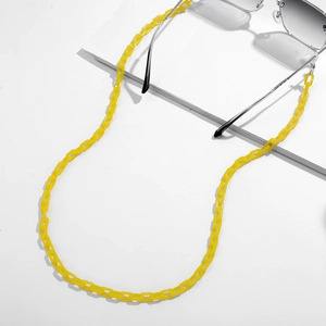 Detailed top view of bright yellow acrylic Y2K chain links for sunglasses and eyewear