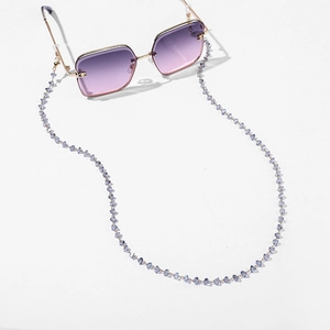 Detail of colorful acrylic beaded eyewear chain with non-slip silicone loops and gold metal