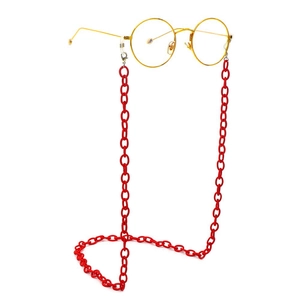 Detail of red acrylic Y2K chain link for glasses with secure clear silicone loop