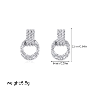 Detailed view of cable texture earrings with dimensions 22mm by 14mm on white backdrop