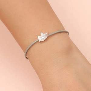 Gray leather cord bracelet featuring a delicate silver unicorn pendant for daily wear