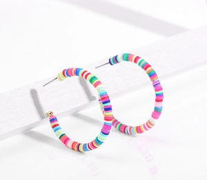 Detail of bohemian rainbow heishi clay bead hoop earrings with golden metallic studs
