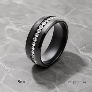 Macro view of 8mm black stainless steel ring with single row of clear zircon stones