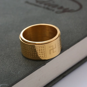 Spinner ring in gold stainless steel with engraved heart sutra and buddhist swastika