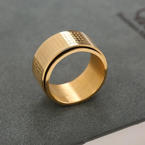 Rotating stainless steel Buddhist Heart Sutra ring in gold with laser-etched scriptures