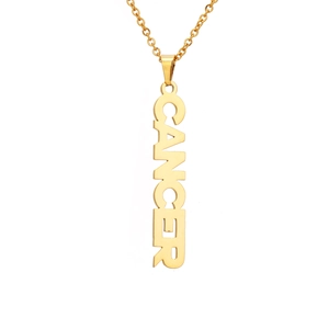 Detailed view of gold 18K plated stainless steel pendant with CANCER zodiac lettering