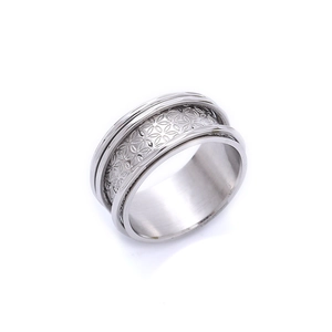 Wide stainless steel band ring with detailed floral engraving and tiered edges