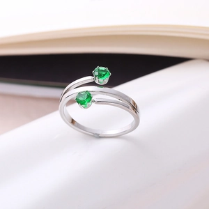Polished stainless steel open ring featuring a double-headed green turquoise inlay design