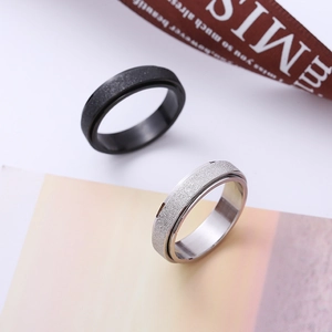 Minimalistische mattierte drehbare Stressabbau-Ringe aus schwarzem und silbernem Stahl