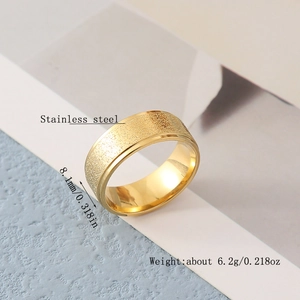 Macro view of 8.1mm golden stainless steel ring with matte finish and smooth inner surface