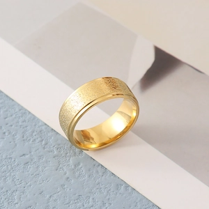 Golden brushed stainless steel couple rings with frosted finish and polished inner band