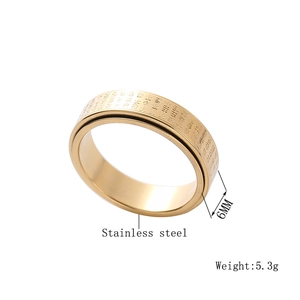 Detail of 6mm gold stainless steel spinning ring with engraved Buddhist scriptures
