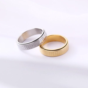Rotating stainless steel spinner ring with engraved Buddhist Heart Sutra scriptures