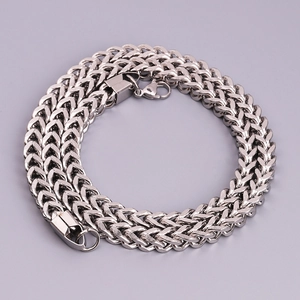 Macro shot of silver Franco link stainless steel chain with secure lobster clasp