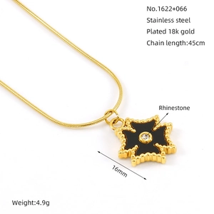 Detail of 18K gold plated stainless steel star necklace with black enamel pendant