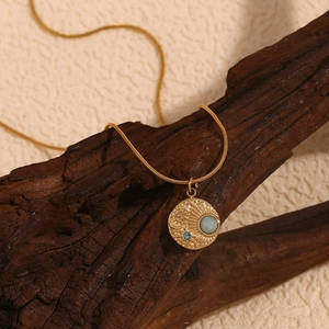 18K gold plated celestial compass necklace with green stone and star details