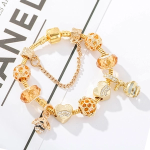 Charming gold-plated bumblebee charm bracelet with honeybee beads and amber crystals