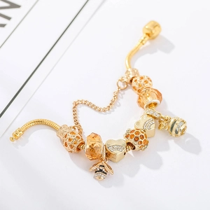 Charming gold-plated bee charm bracelet with honeybee pendant and amber crystal beads