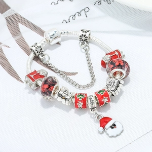 Silver Christmas charm bracelet with Santa, tree and snowflake beads on snake chain