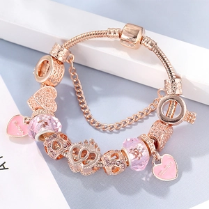 Rose gold bracelet with pink crystal beads, crown charms and Mother heart pendant