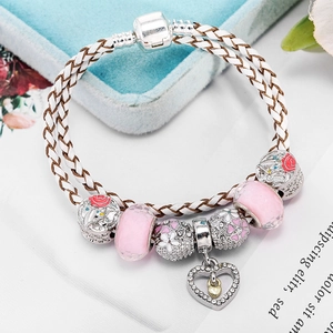 Double-strand braided leather bracelet with pink crystal heart and enamel floral charms