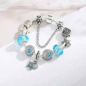 Ocean theme charm bracelet with light blue crystal beads and silver starfish charms