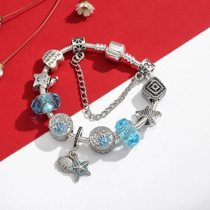 Ocean theme S925 silver charm bracelet with blue glass beads and starfish pendants