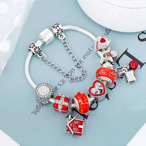 DIY snowman charm bracelet with red enamel house and glass beads in silver finish