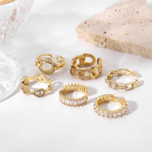 Close-up of six-piece vintage gold-plated zircon ring set with H-link and Cuban chain design