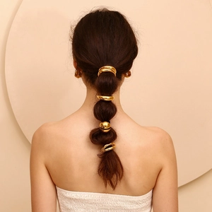 18K gold plated eggshell style hair cuff set with smooth metallic finish on bubble ponytail