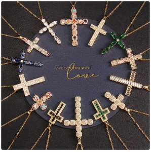 Detailed arrangement of gold cross pendants with colorful micro-pave cubic zirconia crystals