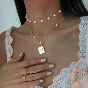 Layered gold soulmate necklace with star moon pendant and pearl choker jewelry set