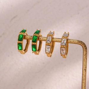 Bamboo style stainless steel hoop earrings with green and white baguette cut zircons