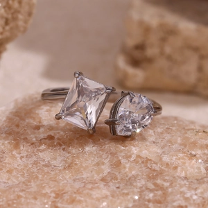 Detail of 18K gold-plated ring featuring rectangle and pear-cut cubic zirconia stones