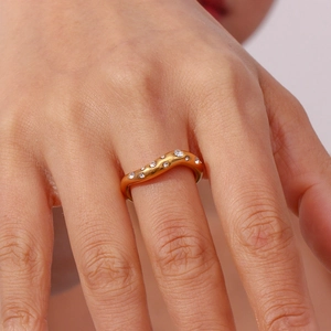 Detail of 18K gold-plated irregular wave ring featuring micro-inset zircon stones