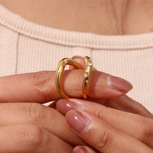 Detail of 18K gold-plated irregular wave ring with micro-pave cubic zirconia crystals