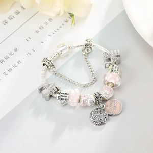 DIY mother theme charm bracelet with pink beads and MOM engraved heart pendants