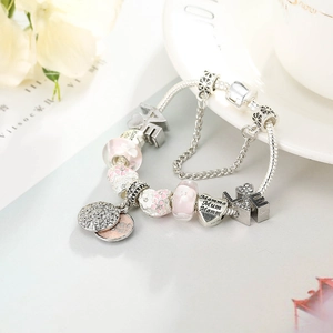 Silver snake chain bracelet with pink floral beads and engraved Mom heart charms
