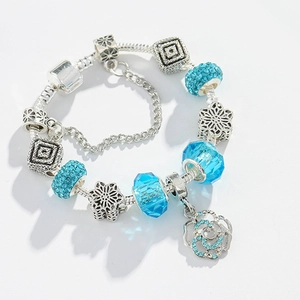 Luxury snake chain bracelet featuring blue crystal charms and silver rose pendant