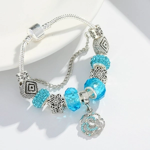 Silver snake chain bracelet with sky blue glass beads and hollow flower charms