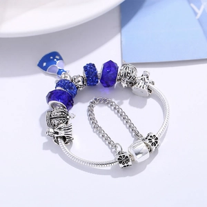Bracelet serpent argenté style Pandora avec perles en verre bleues et breloques couronne