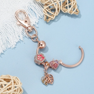 Rose gold DIY keychain with sparkling floral leaf pendants and pink cubic zirconia