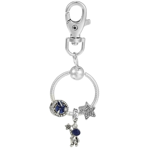 Detail of silver astronaut charm with blue enamel starry bead and star pendant on a lobster clasp