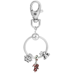 Macro detail of silver metal keychain with gingerbread man and bear charms
