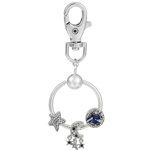Silver celestial keychain with moon and star pendants featuring blue enamel and crystals