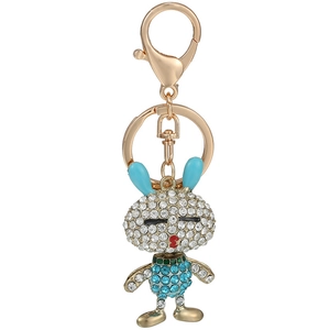 Vue détaillée du porte-clés lapin aux strass bleus avec mousqueton en alliage doré