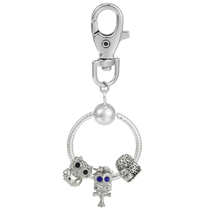 Detail of silver owl charms with blue rhinestones on a round snake chain keychain