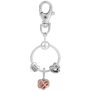 Detailed view of silver heart charms and rose gold crystal pendant on key ring