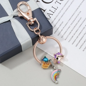 Rose gold keychain with purple unicorn, rainbow pendant and crystal charms for bags