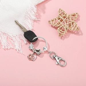 Silver heart keychain with Amour Love engraving and lobster clasp on car key
